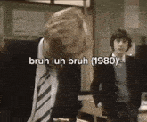 a man in a suit and tie says bruh luh bruh