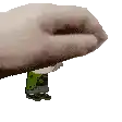 a pixel art of a hand holding a frog on its feet .