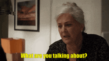 a woman says what are you talking about in yellow letters