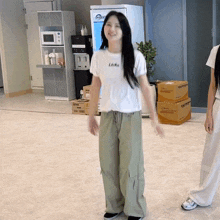 a woman wearing a white shirt that says ' i like ' on it