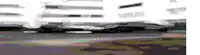 a blurred image of cars driving on a road