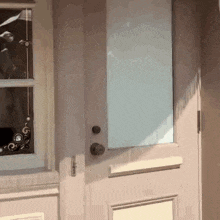 a close up of a door with a window and a door handle .