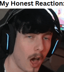 a man wearing headphones is making a funny face and the caption says my honest reaction