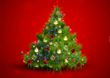 a green christmas tree with red and blue decorations