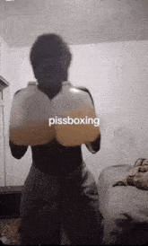 a man wearing boxing gloves with the word pissboxing on the bottom