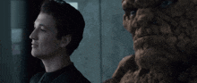 a man in a black shirt is looking at something