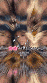 a blurry picture of a woman 's face surrounded by a bunch of other people 's faces