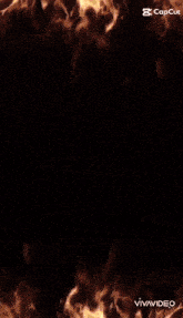 a person 's face is surrounded by flames on a black screen