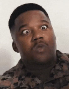 a man making a funny face with his eyes wide open