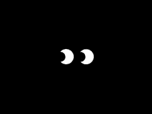 two white circles on a black background that look like eyes