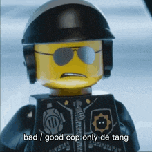 a lego police officer with sunglasses and a helmet says bad / good cop only de tang