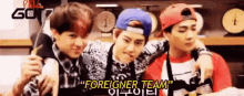 a group of young men are standing next to each other and one of them says foreigner team