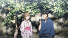 a man and a woman standing next to each other