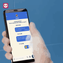 a man is taking a shower while holding a phone
