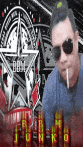 a man wearing sunglasses smoking a cigarette in front of a bbm logo