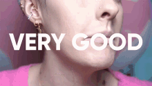 a close up of a woman 's face with the words " very good " above her