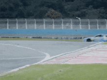 a race car is going around a turn on a track