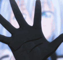 a close up of a person 's hand with a glove on