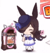 a cartoon girl is standing next to a jukebox and wearing a blue hat .