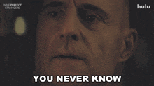a close up of a man 's face with the words " you never know " below him