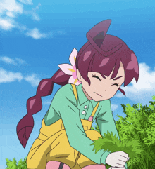 a cartoon girl with a flower in her hair is picking leaves from a bush