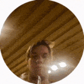 a woman is taking a selfie with a glass of wine in a circle .