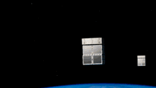 an artist 's impression of a space station flying over the earth
