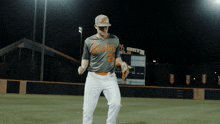 a baseball player wearing a bears jersey stands on a field