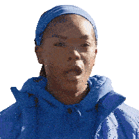 a woman wearing a blue headband and a blue jacket looks surprised