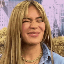 a close up of a woman 's face with her eyes closed .