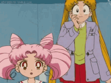 a girl with pink hair is standing next to a man with blonde hair