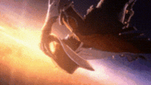 a close up of a person 's hand holding a sword in a dark room .