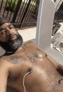 a shirtless man with a tattoo on his chest that says a on it