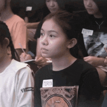 a girl with the name moreen on her shirt