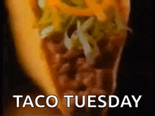 a taco with the words taco tuesday on it