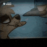 a cartoon dog is looking at another dog on a screen .