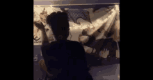 a man is standing in front of a overwatch banner