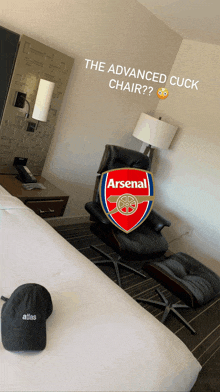a chair with the arsenal logo on it is in a hotel room