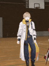 a man in a white coat is standing in front of a basketball court