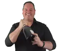 a man in a black shirt is opening a bottle