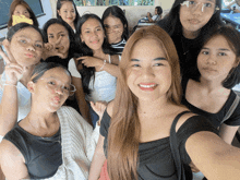 a group of young women are posing for a photo