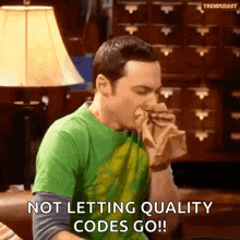 a man in a green shirt is blowing his nose and saying " not letting quality codes go " .