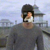 a man has a picture of a child on his face