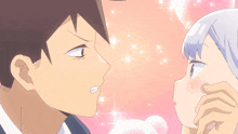 a boy and a girl are kissing and the girl is covering her face with her hand