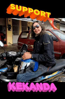 a man is sitting on a motorcycle with the words support kebanda behind him