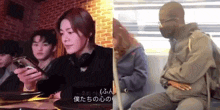 a group of people are sitting at a table with a man wearing a mask holding a cell phone .