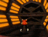 a cartoon character with a red hat is standing in front of a large black object