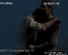 a man is being held by another man in a video from the property of gaumont