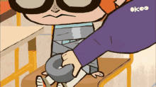 a cartoon character with a purple shirt that says okeo on it