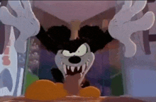 mickey mouse is a cartoon character with a very scary face and sharp teeth .